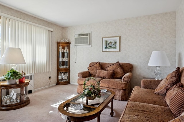 living room with wallpapered walls, baseboards, light colored carpet, and a wall mounted air conditioner