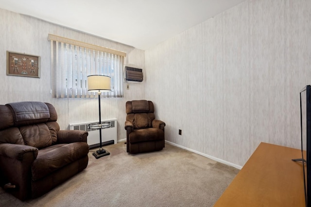 living area with wallpapered walls, baseboards, a wall unit AC, radiator, and carpet