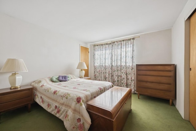 bedroom featuring dark carpet