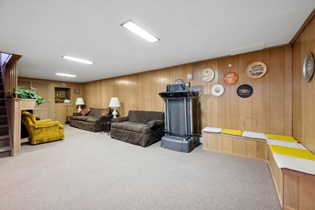 living room with stairs and light colored carpet