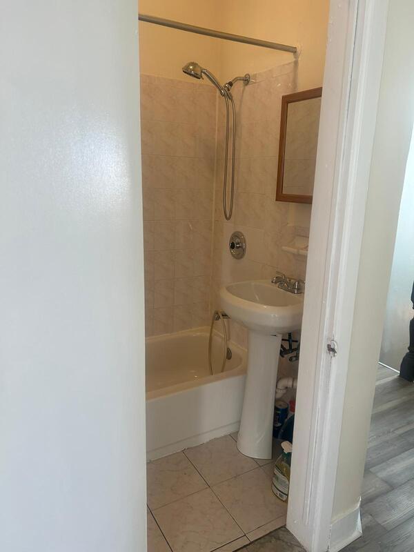 bathroom featuring tile patterned flooring and washtub / shower combination