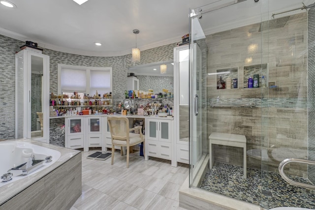 bathroom with a washtub, a shower stall, and ornamental molding