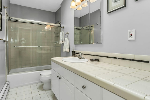 full bathroom featuring baseboard heating, vanity, toilet, tile patterned floors, and enclosed tub / shower combo