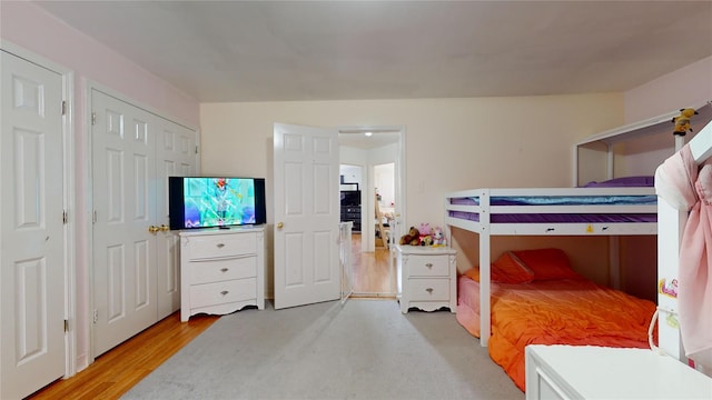 bedroom with light wood-type flooring