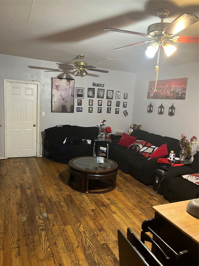 living room featuring ceiling fan and wood finished floors