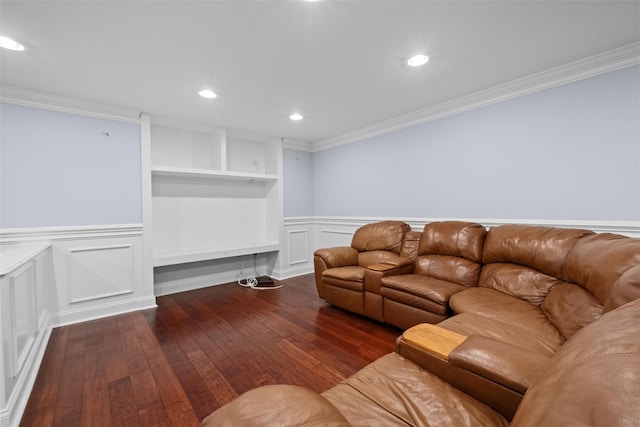 living room featuring a wainscoted wall, dark wood finished floors, crown molding, and recessed lighting