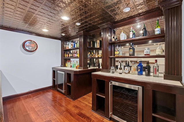 bar with a dry bar, an ornate ceiling, and wine cooler