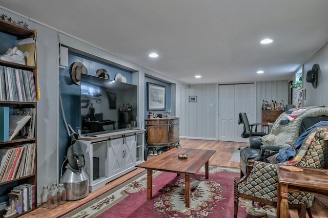 living room with recessed lighting and light wood-style flooring