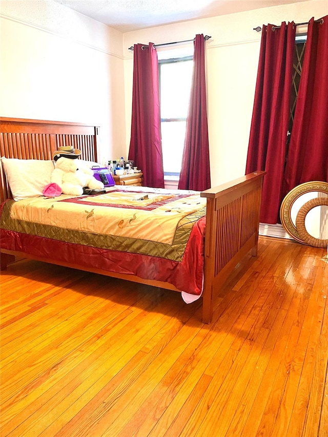 bedroom with wood finished floors