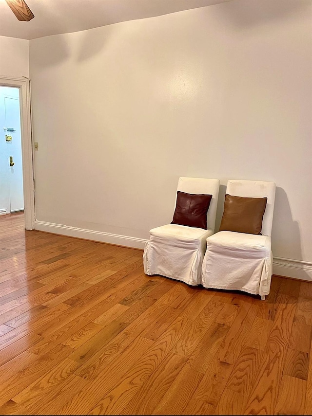 unfurnished room featuring light wood-type flooring and baseboards