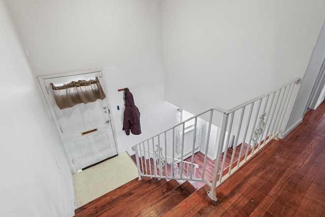 stairway featuring hardwood / wood-style flooring