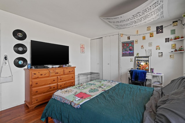 bedroom featuring a closet and wood finished floors