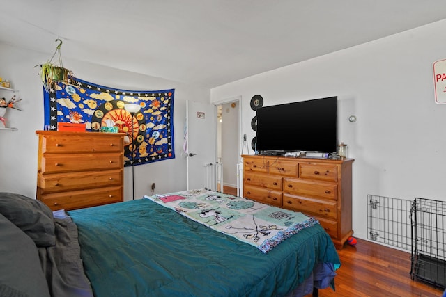 bedroom with wood finished floors