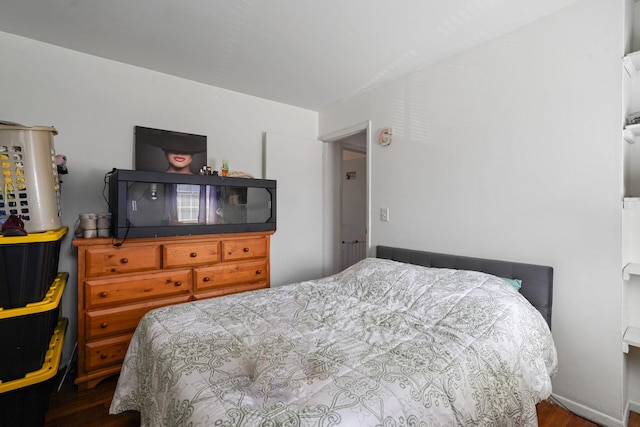 bedroom featuring wood finished floors