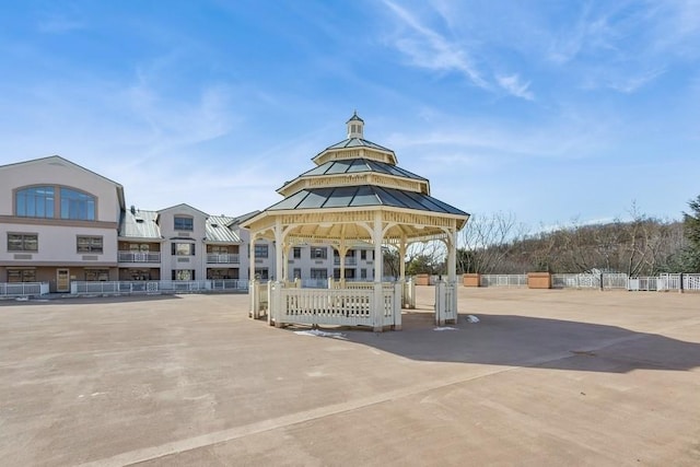 view of property's community featuring a gazebo and fence