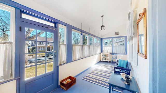 sunroom with vaulted ceiling and plenty of natural light