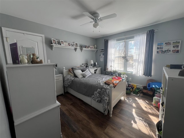 bedroom featuring dark wood-style floors and a ceiling fan