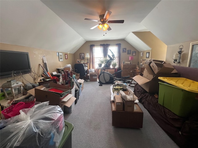 carpeted bedroom with vaulted ceiling and ceiling fan