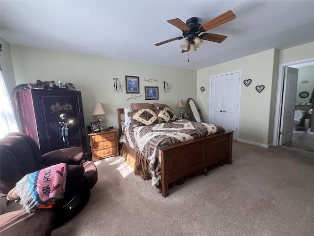 carpeted bedroom featuring ceiling fan and baseboards