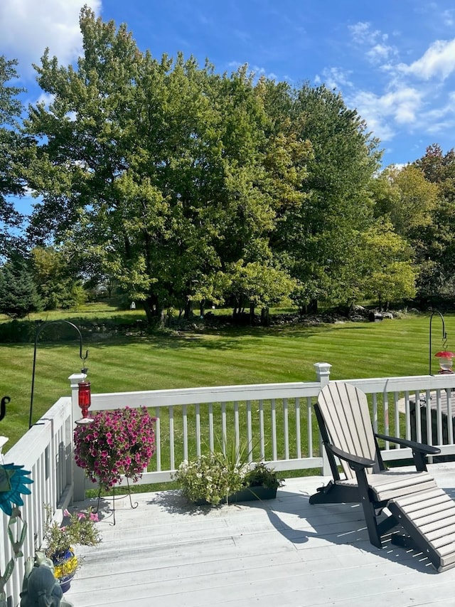 wooden deck with a yard