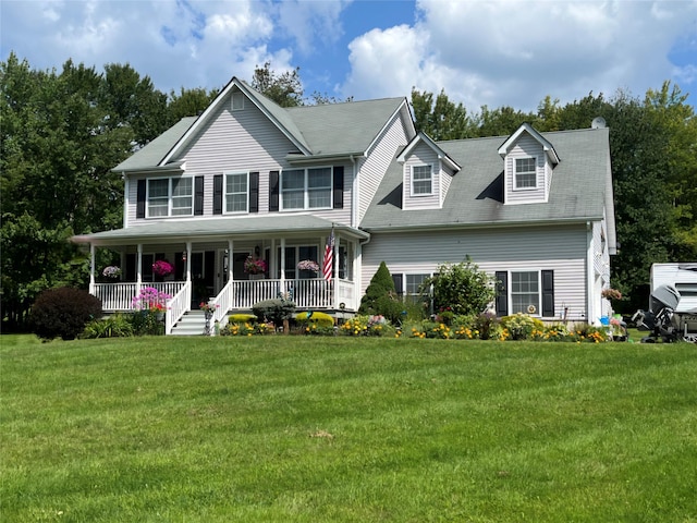 view of front of house featuring covered porch and a front yard