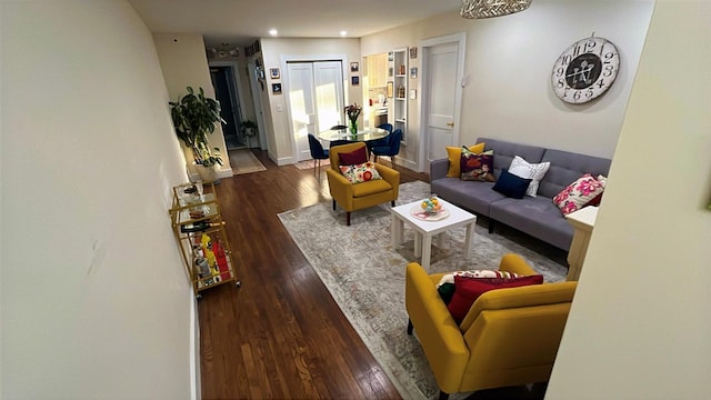 living room featuring dark wood-style floors, baseboards, and recessed lighting