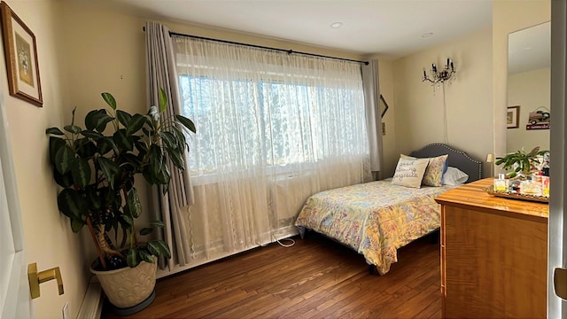 bedroom featuring dark wood-style flooring