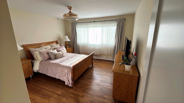 bedroom with dark wood-style flooring