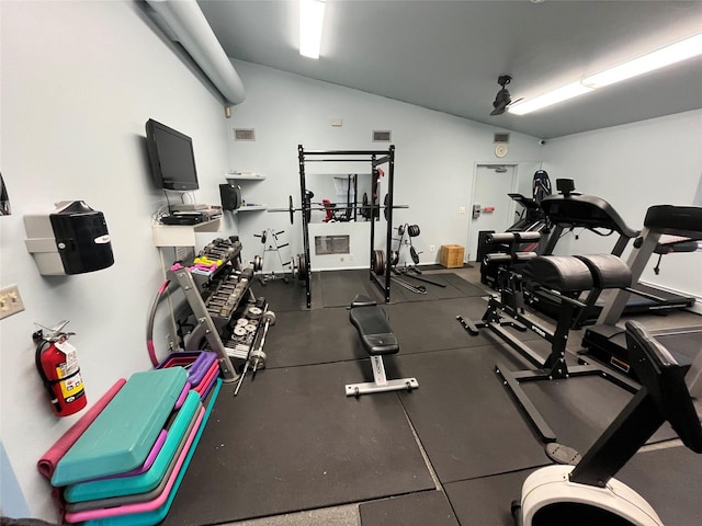 workout area featuring lofted ceiling and visible vents