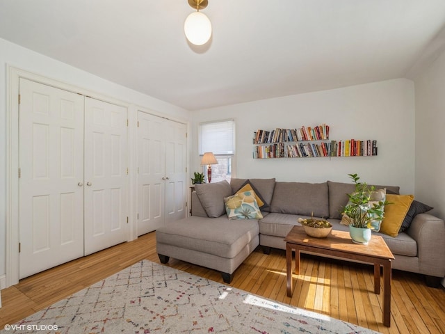 living area with hardwood / wood-style floors