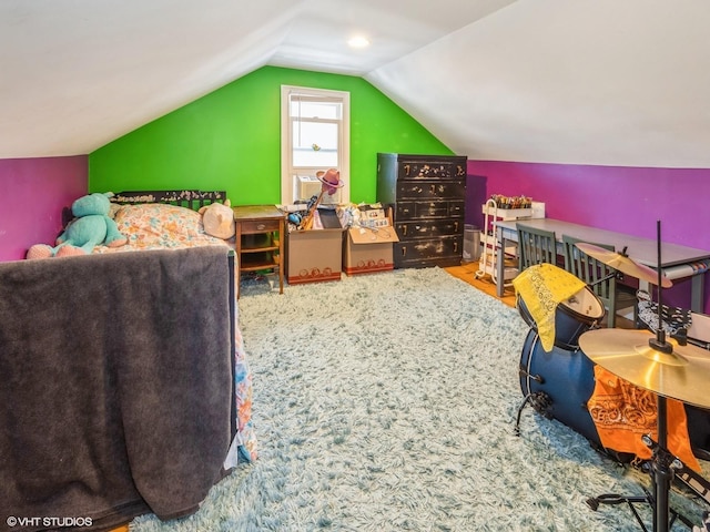 bedroom featuring lofted ceiling