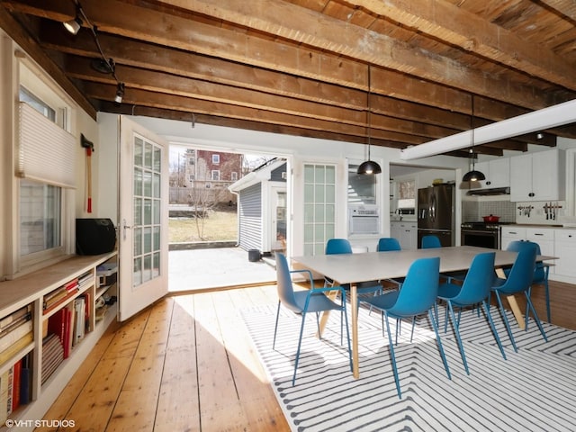 sunroom with french doors and beam ceiling