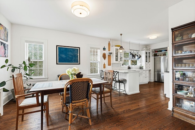 dining area with dark wood finished floors