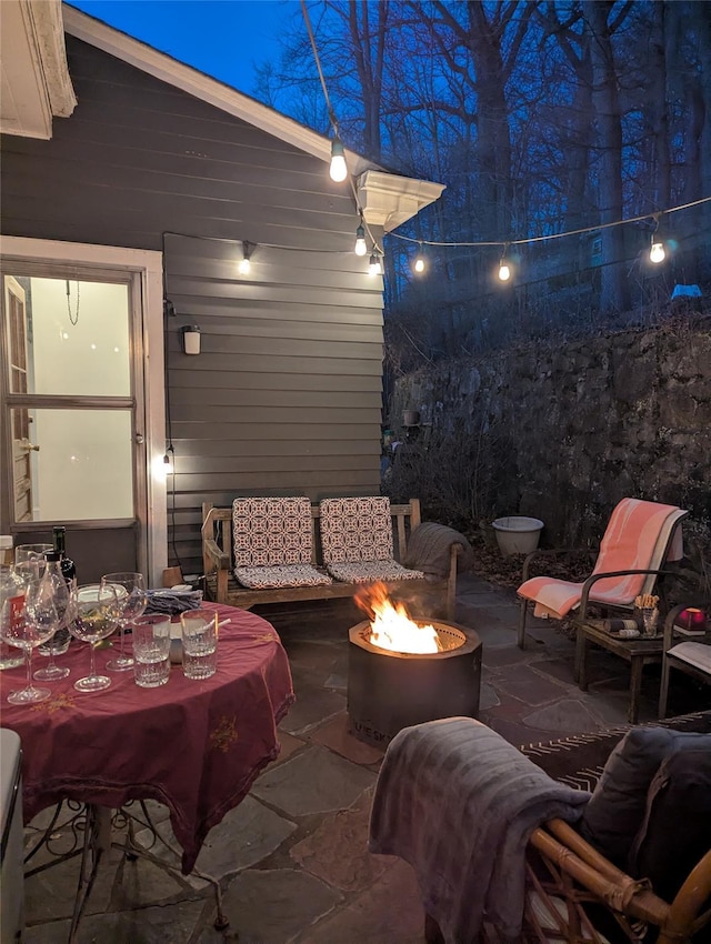 view of patio / terrace with a fire pit