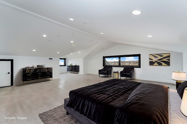 bedroom featuring light wood-type flooring, lofted ceiling, and recessed lighting