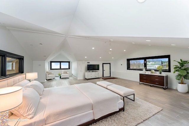 bedroom with light wood-style floors, recessed lighting, and high vaulted ceiling