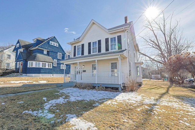 view of front of home with a porch and a chimney