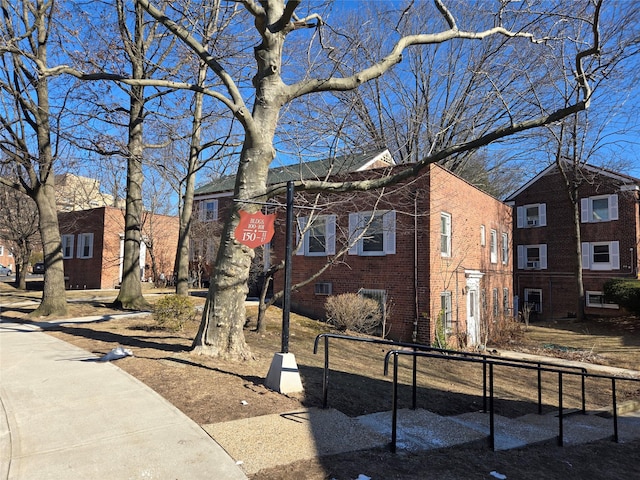 view of front facade featuring brick siding