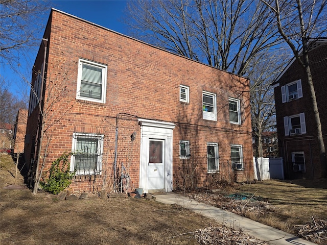 view of front of home with brick siding