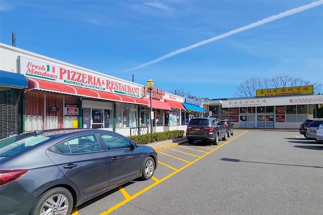 view of property with uncovered parking