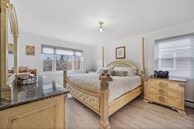 bedroom featuring light wood-style flooring