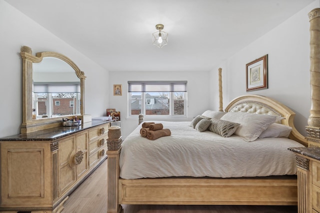 bedroom with light wood finished floors