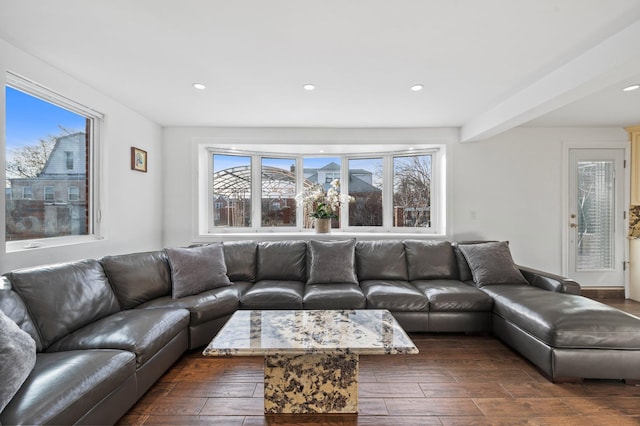 living area with dark wood finished floors and recessed lighting