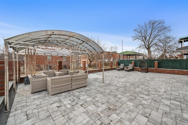 view of patio / terrace with a fenced backyard and an outdoor living space