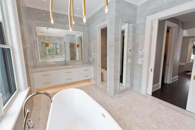 bathroom with a freestanding tub, a walk in shower, crown molding, and vanity