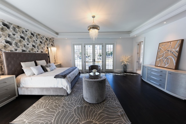 bedroom with recessed lighting, wood finished floors, baseboards, french doors, and a raised ceiling