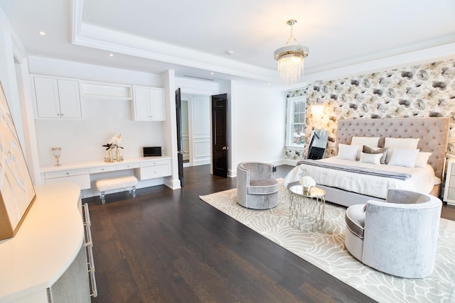 bedroom with a tray ceiling, dark wood finished floors, crown molding, and recessed lighting