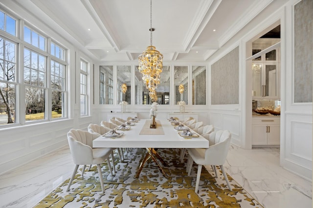 dining space with a decorative wall, a notable chandelier, marble finish floor, and beamed ceiling
