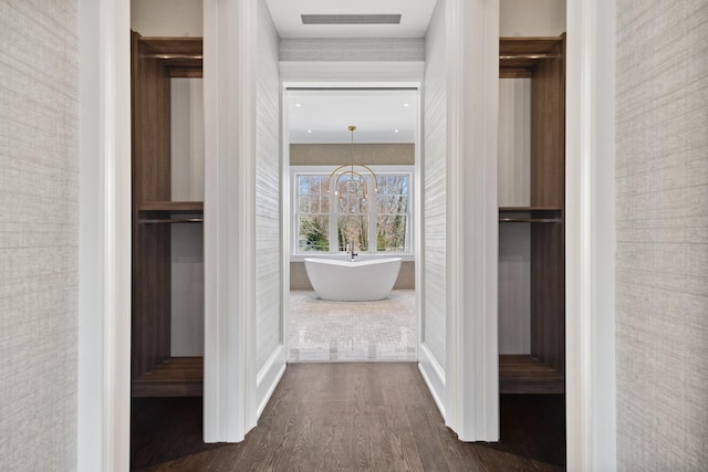 interior space featuring dark wood-style flooring, baseboards, and visible vents