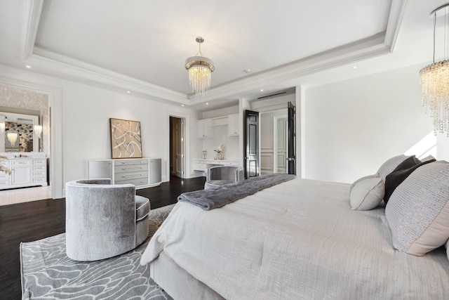 bedroom with a tray ceiling, crown molding, wood finished floors, and recessed lighting